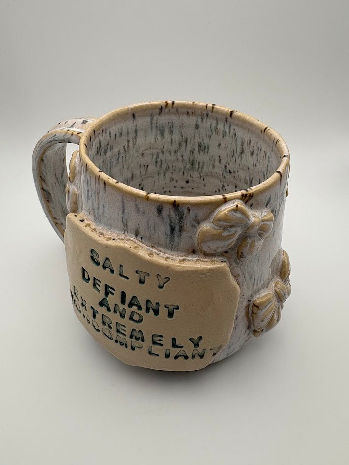 Spotted "Salty, Defiant, and Extremely Noncompliant" Bow Mug